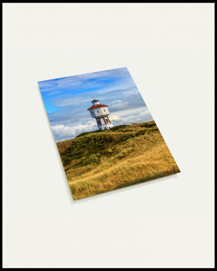 Eine Postkarte von einem weißen Wasserturm auf der Insel Langeoog.